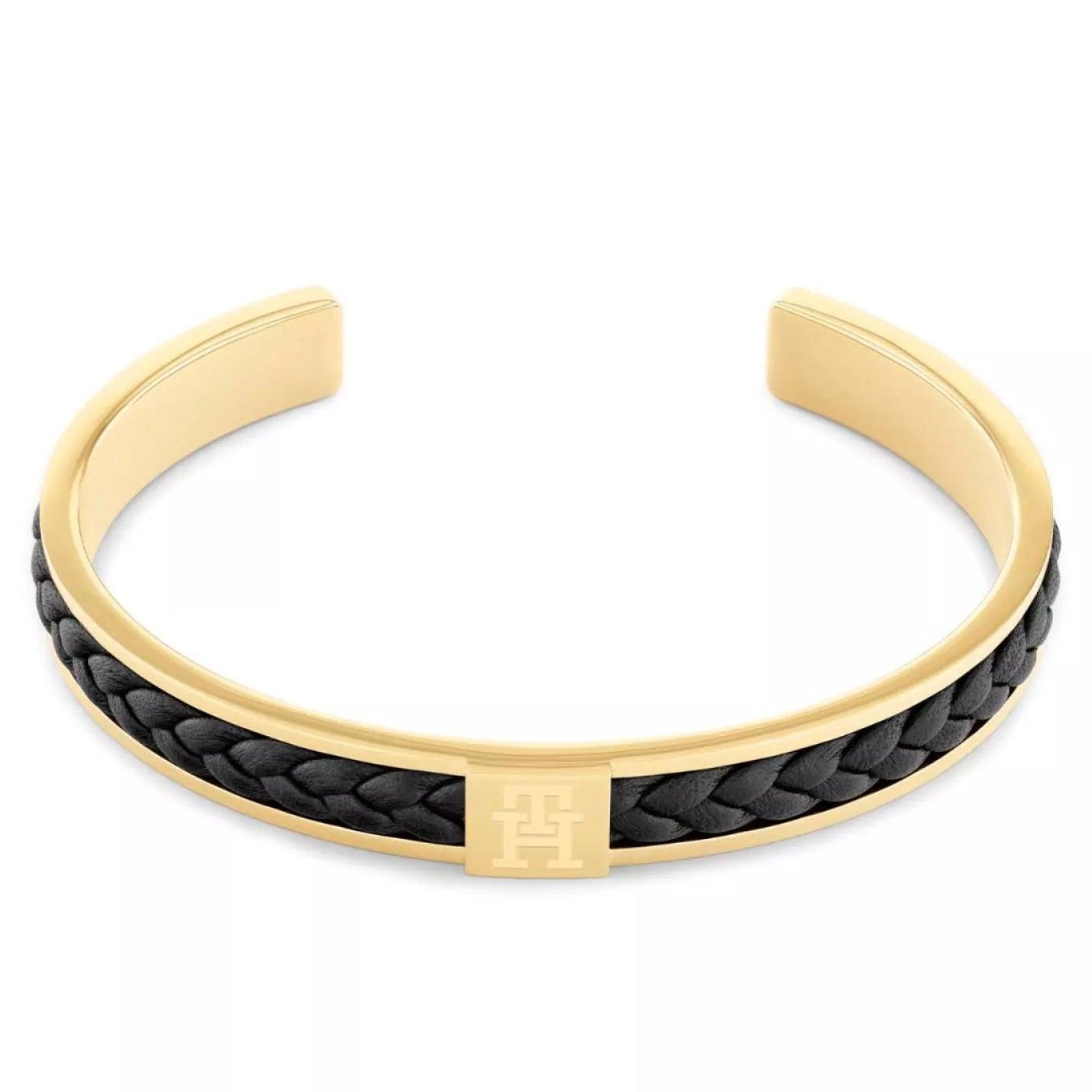 Ανδρικό βραχιόλι χειροπέδα Tommy Hilfiger από ατσάλι σε χρυσό χρώμα με μαύρο δέρμα.