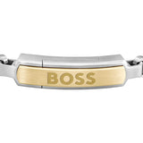 Ανδρικό βραχιόλι Boss 1580597M ατσάλινο δίχρωμο με ασημί μπρασελέ και χρυσό στοιχείο, κατασκευασμένο από χειρουργικό ατσάλι σε σχέδιο μπρασελέ.