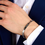 Ανδρικό βραχιόλι Maserati Diamonds JM125ATY21 ατσάλινο ασημί με μαύρο κεραμικό, διαμαντάκια και μάυρη τρίαινα-φορεμένο.