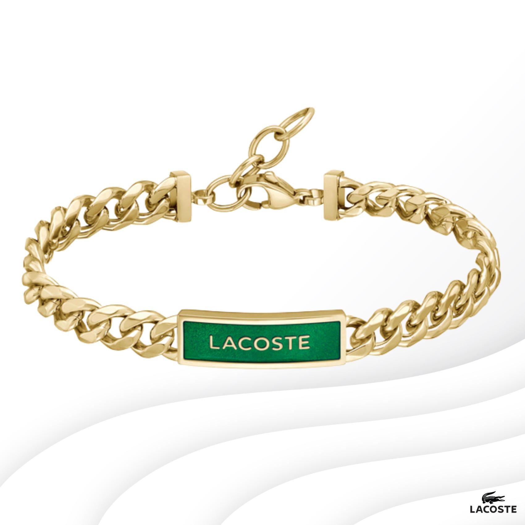 Ατσάλινο βραχιόλι Lacoste 2040323 ταυτότητα σε χρυσό χρώμα διακοσμημένο με πράσινο σμάλτο και ρυθμιζόμενο κούμπωμα από ανοξείδωτο ατσάλι.