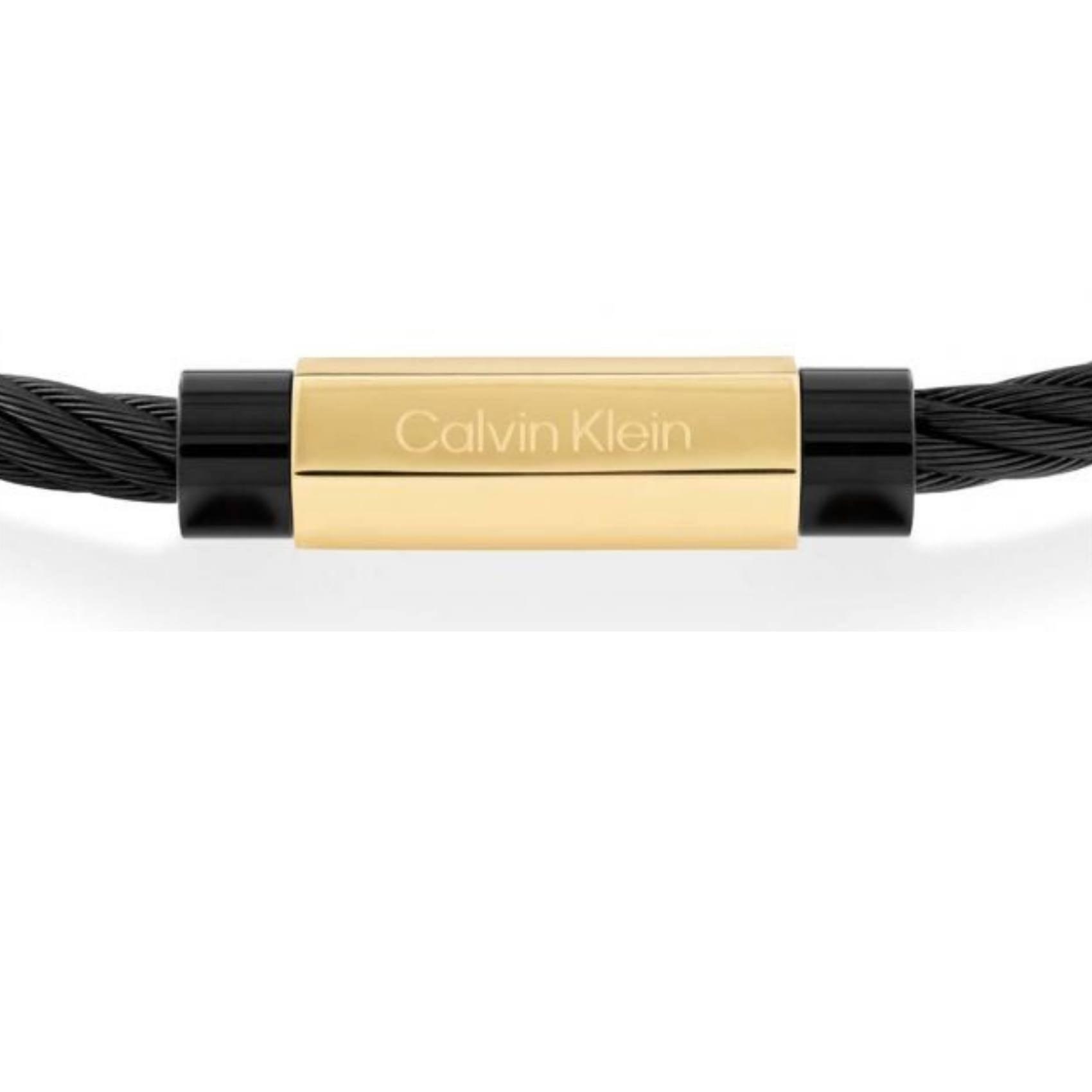 Ανδρικό βραχιόλι Calvin Klein 35000420 κατασκευασμένο από ατσάλι σε μαύρο χρώμα με στριφτό σχέδιο, διακοσμημένο με χρυσό στοιχείο.