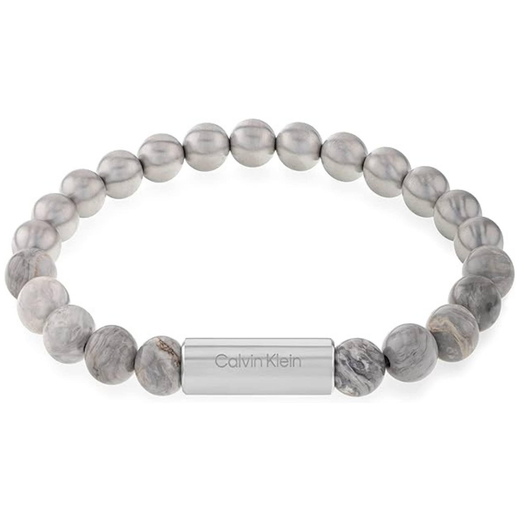 Ανδρικό βραχιόλι Calvin Klein 35000427 με χάντρες ίασπις σε γκρι χρώμα διακοσμημένο με κυλινδρικό στοιχείο από ανοξείδωτο ατσάλι σε ασημί χρώμα.