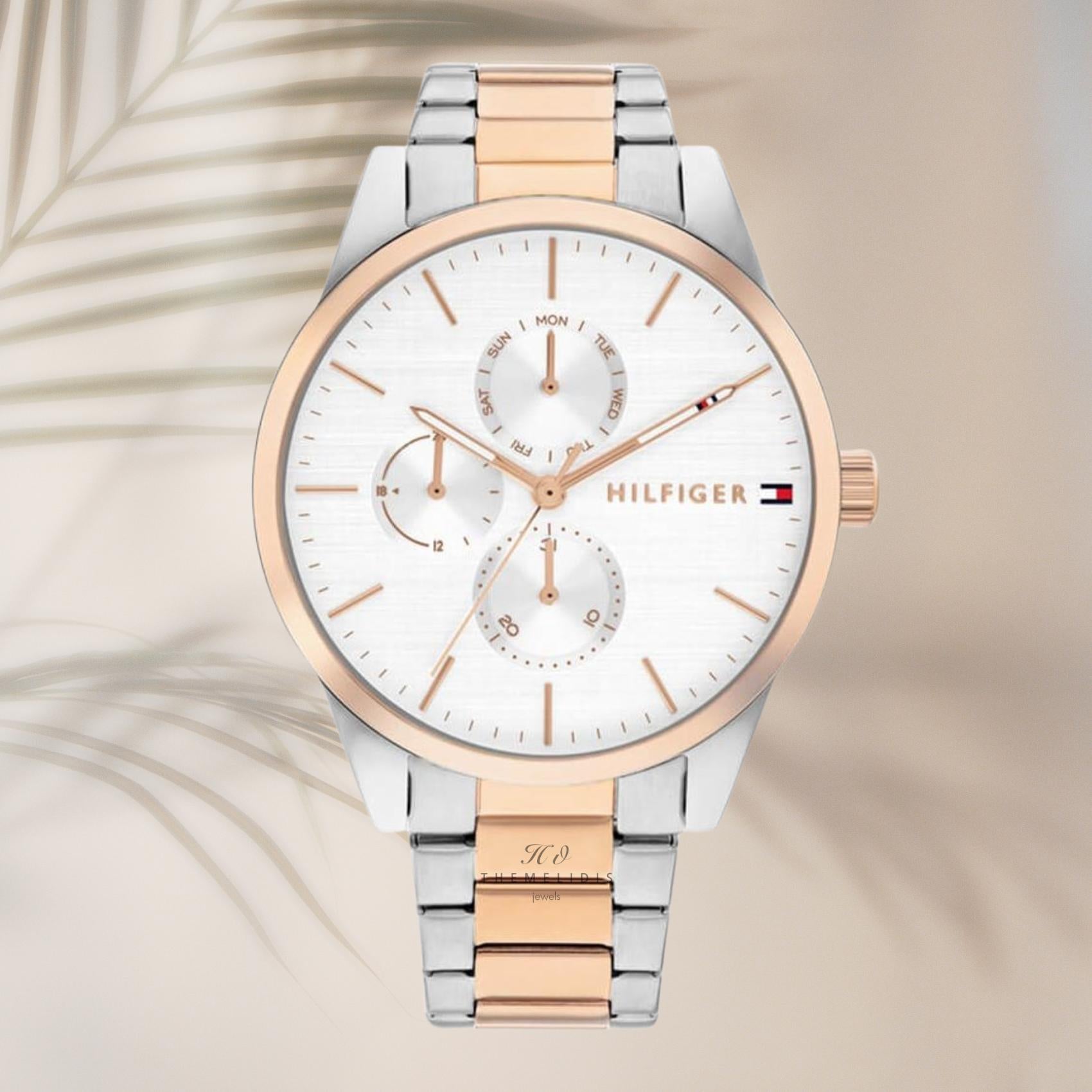 Γυναικείο ρολόι Tommy Hilfiger Camille 1782768 με δίχρωμο ατσάλινο μπρασελέ σε ασημί-ροζ χρυσό χρώμα και ασημί καντράν 38mm, σε φόντο.