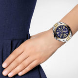 Γυναικείο ρολόι Michael Kors Bradshaw MK5976 χρονογράφος με δίχρωμο ατσάλινο μπρασελέ σε χρυσό-ασημί χρώμα, στρογγυλό μπλε καντράν με ημερομηνία και στεφάνι 42mm.
