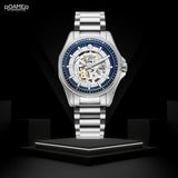 Αυτόματο ρολόι Roamer Rockshell Mark III Skeleton 220984-41-45-20 με ασημί ατσάλινο μπρασελέ και διάφανο ασημί skeleton καντράν διαμέτρου 44mm.