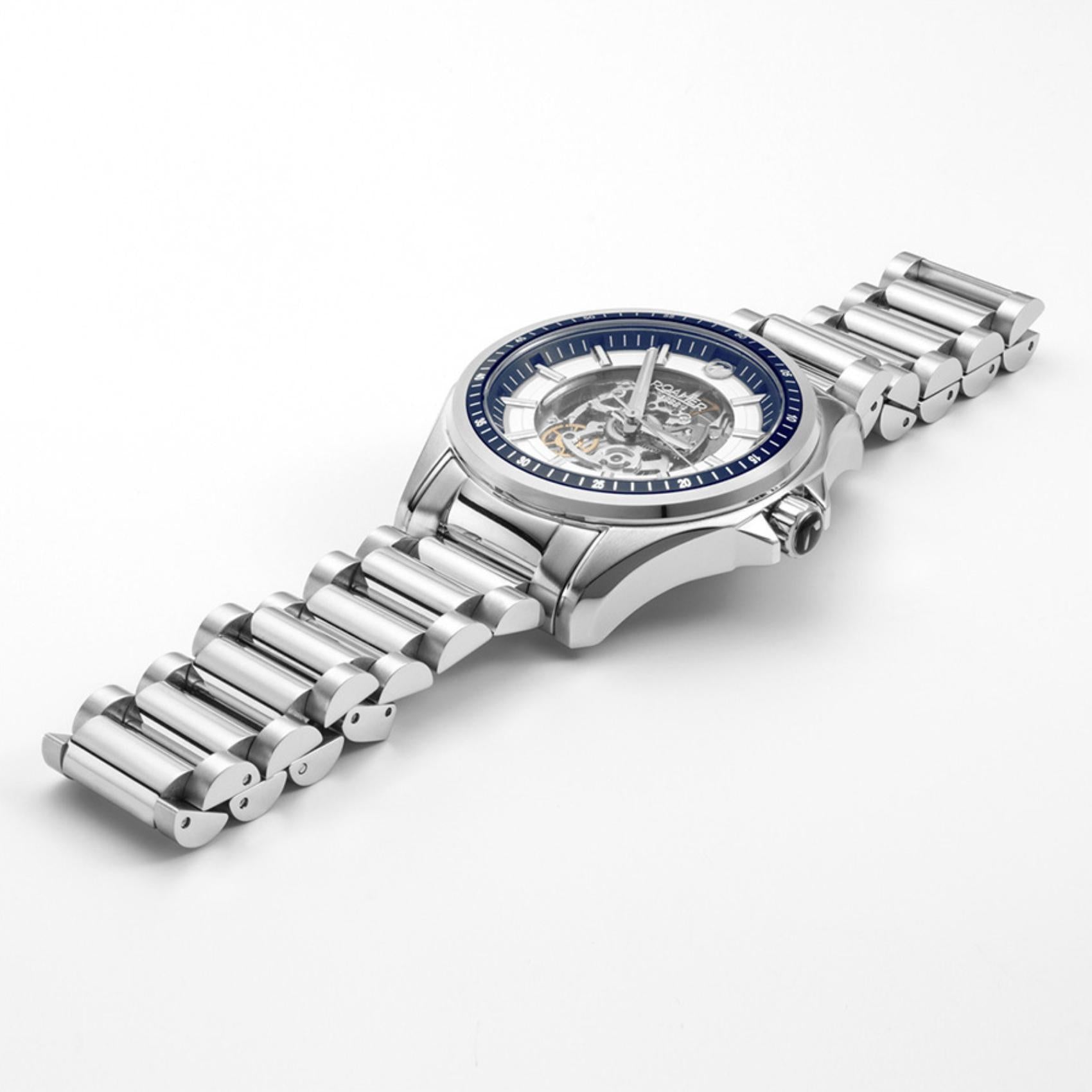 Αυτόματο ρολόι Roamer Rockshell Mark III Skeleton 220984-41-45-20 με ασημί ατσάλινο μπρασελέ και διάφανο ασημί skeleton καντράν διαμέτρου 44mm.