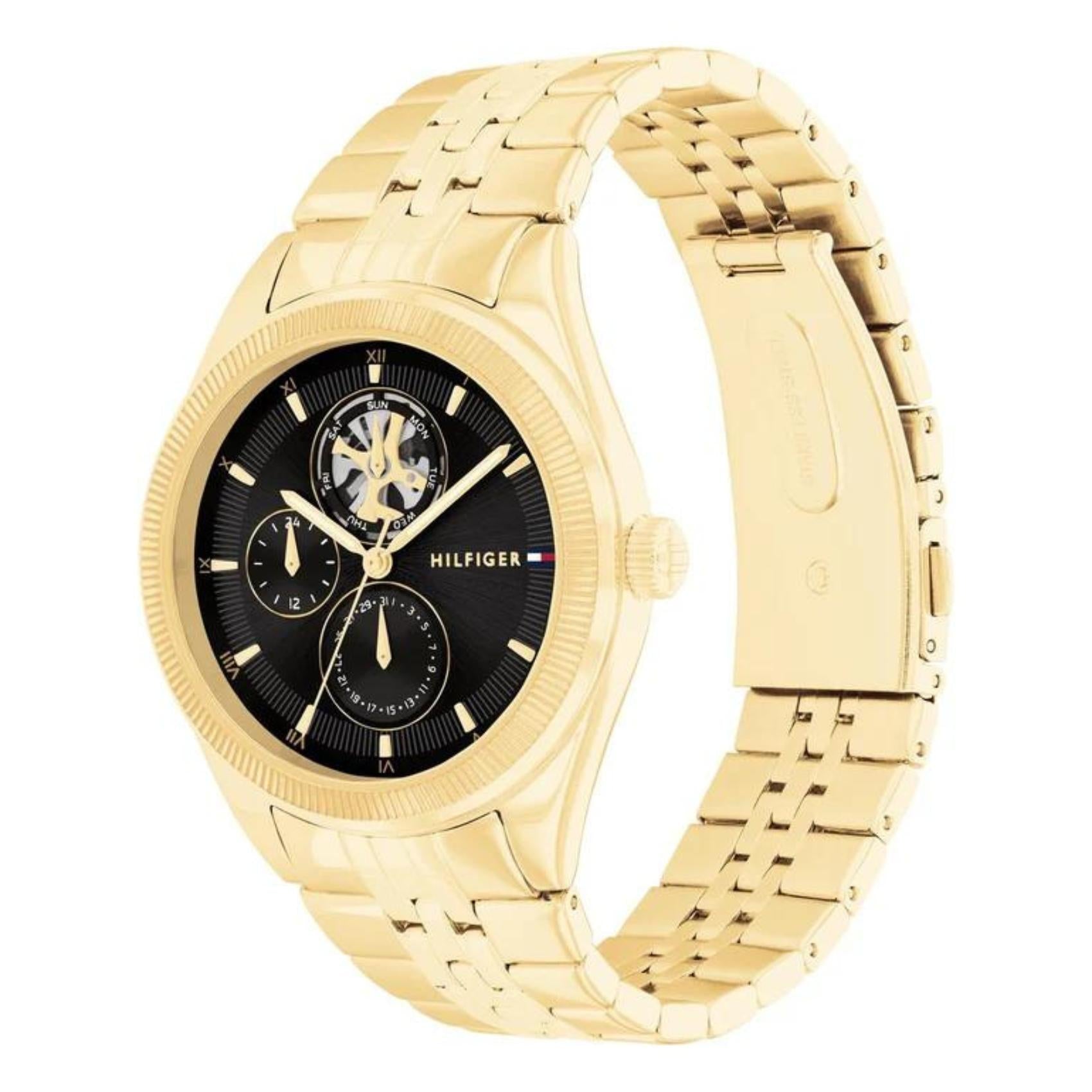 Ρολόι Tommy Hilfiger Monica 1782717 με χρυσό ατσάλινο μπρασελέ και μαύρο καντράν διαμέτρου 38mm.