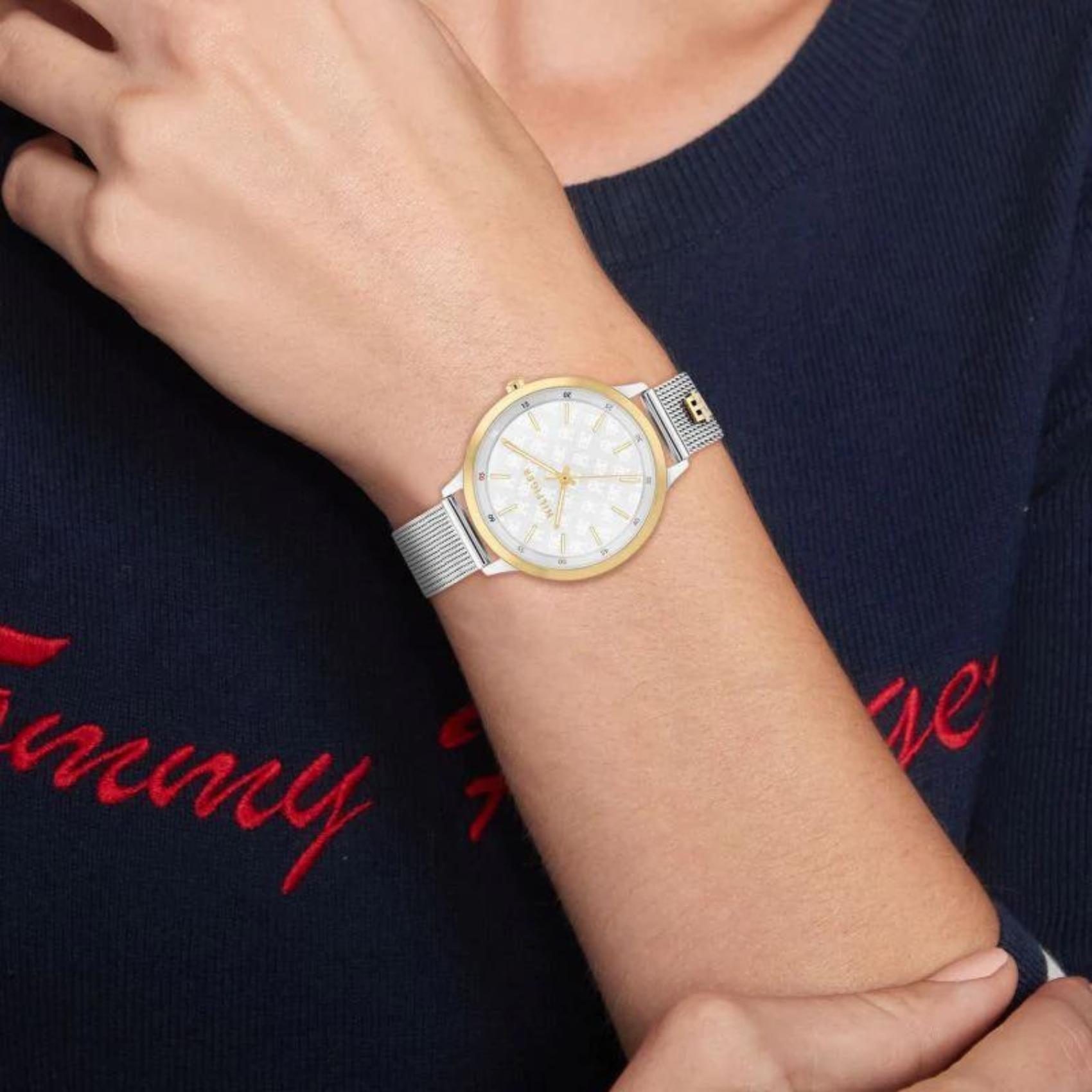 Ρολόι Tommy Hilfiger Iris 1782586, με ασημί μπρασελέ και λευκό καντράν διαμέτρου 36mm με χρυσούς δείκτες.