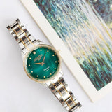 Ρολόι Roamer Venus Diamonds 601857-47-59-20 με δίχρωμο ασημί-χρυσό ατσάλινο μπρασελέ, πράσινο φίλντισι καντράν με διαμάντια, μηχανισμό μπαταρίας quartz, τζαμάκι από ζαφείρι και στεφάνι διαμέτρου 30mm.