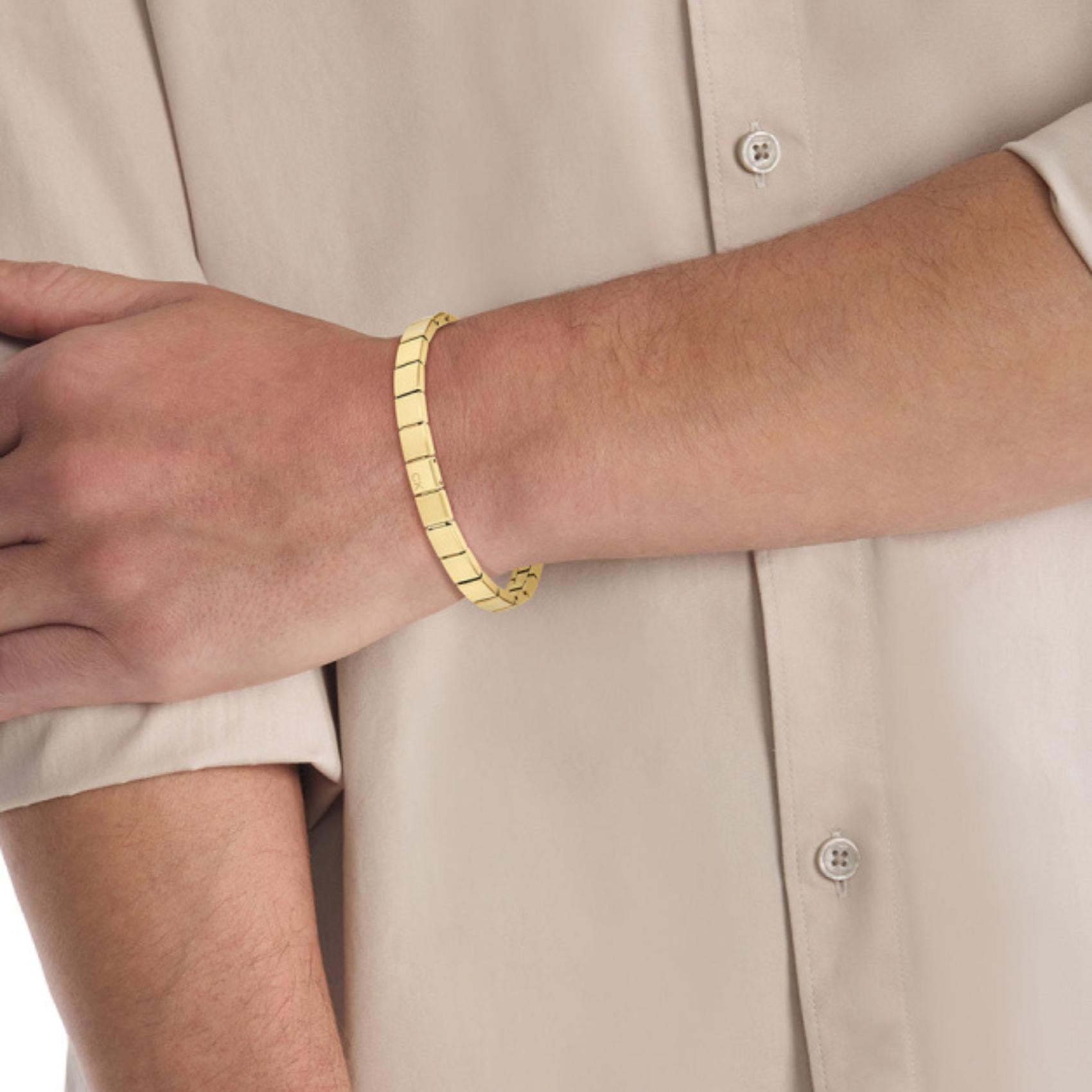 Ατσάλινο βραχιόλι χειροπέδα calvin klein 35000489 σε χρυσό χρώμα.