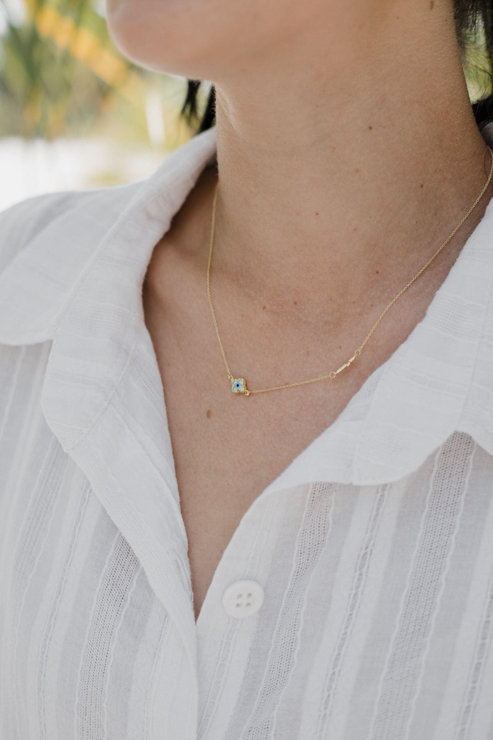 Χρυσό κολιέ Κ9 με ματάκι φίλντισι και σταυρό