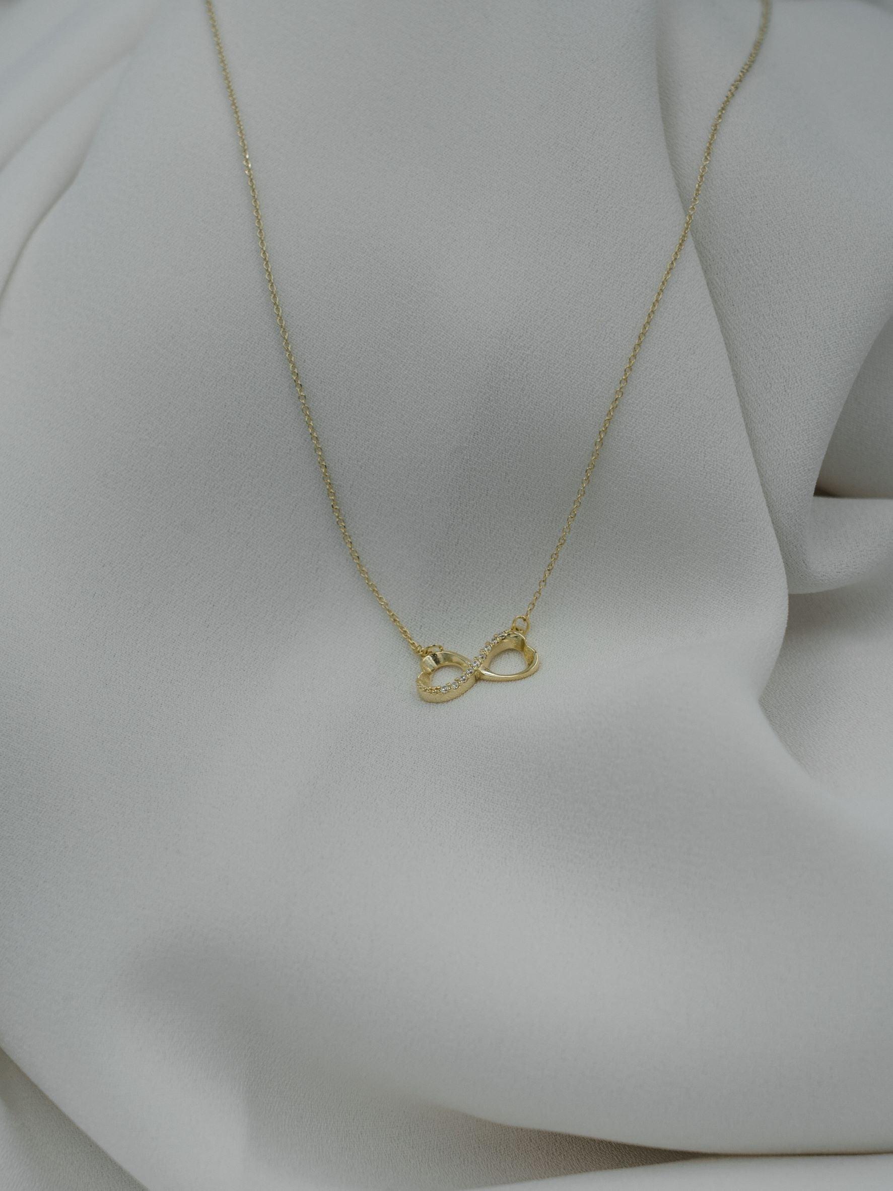 Χρυσό κολιέ Κ14 άπειρο με πέτρες