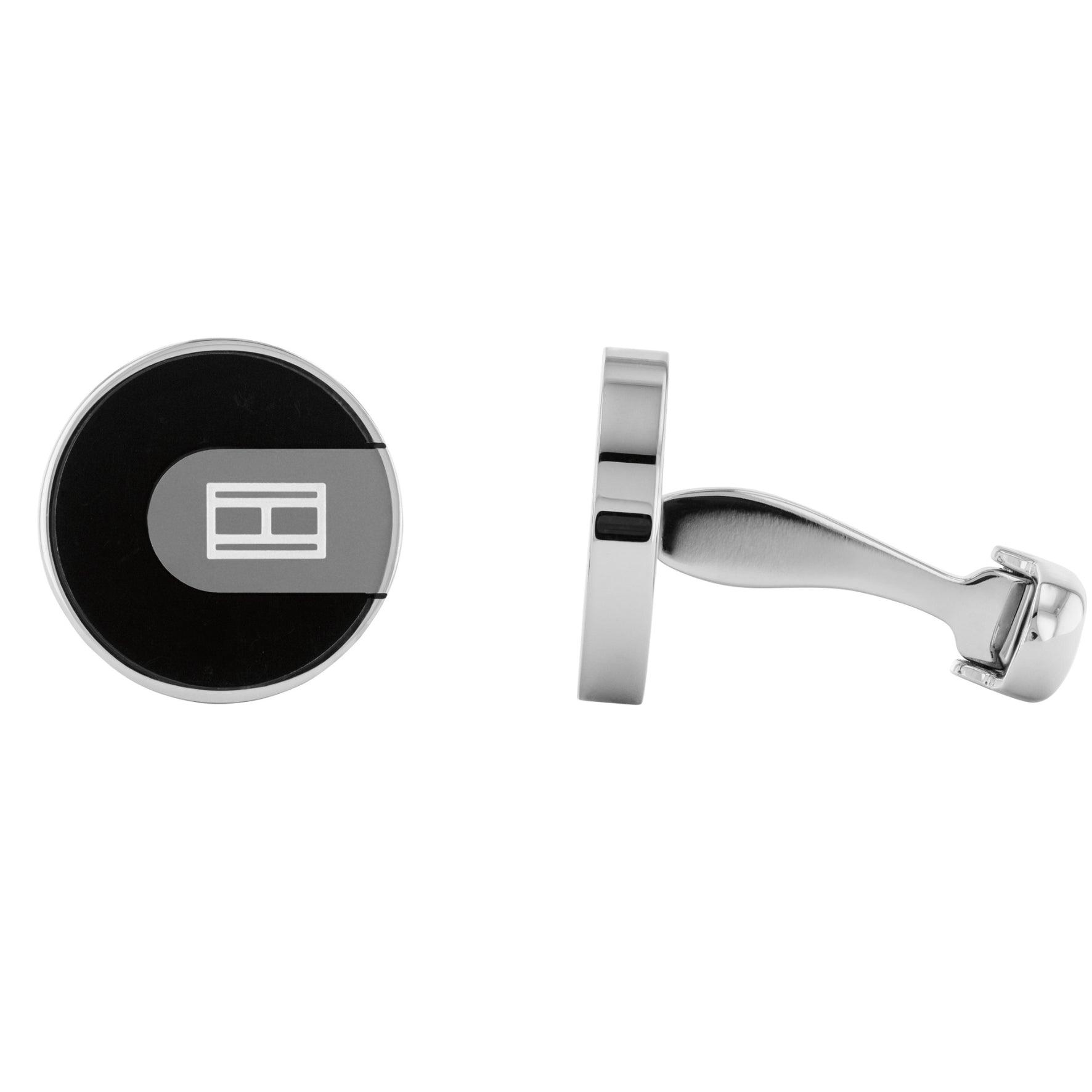Ανδρικά μανικετόκουμπα Tommy Hilfiger σε ασημένιο χρώμα στρογγυλό σχήμα και μαύρο σμάλτο κατασκευασμένα από χειρουργικό ατσάλι.
