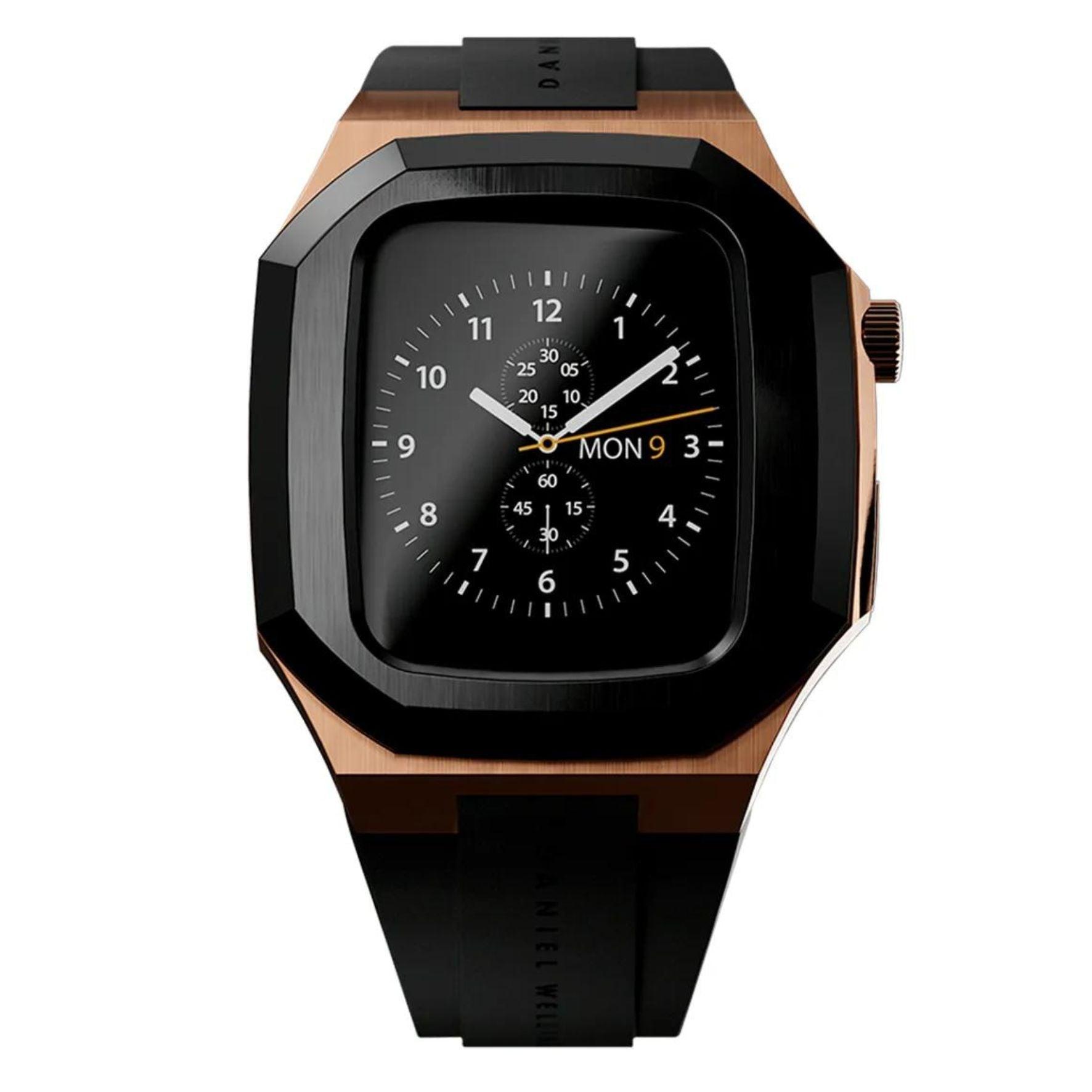 Θήκη smartwatch daniel wellington dw01200002 συμβατή με Apple Watch Series 6, 5, 4 και Apple Watch SE σε ροζ χρυσό χρώμα με μαύρο καουτσούκ λουράκι και τετράγωνο σχήμα.