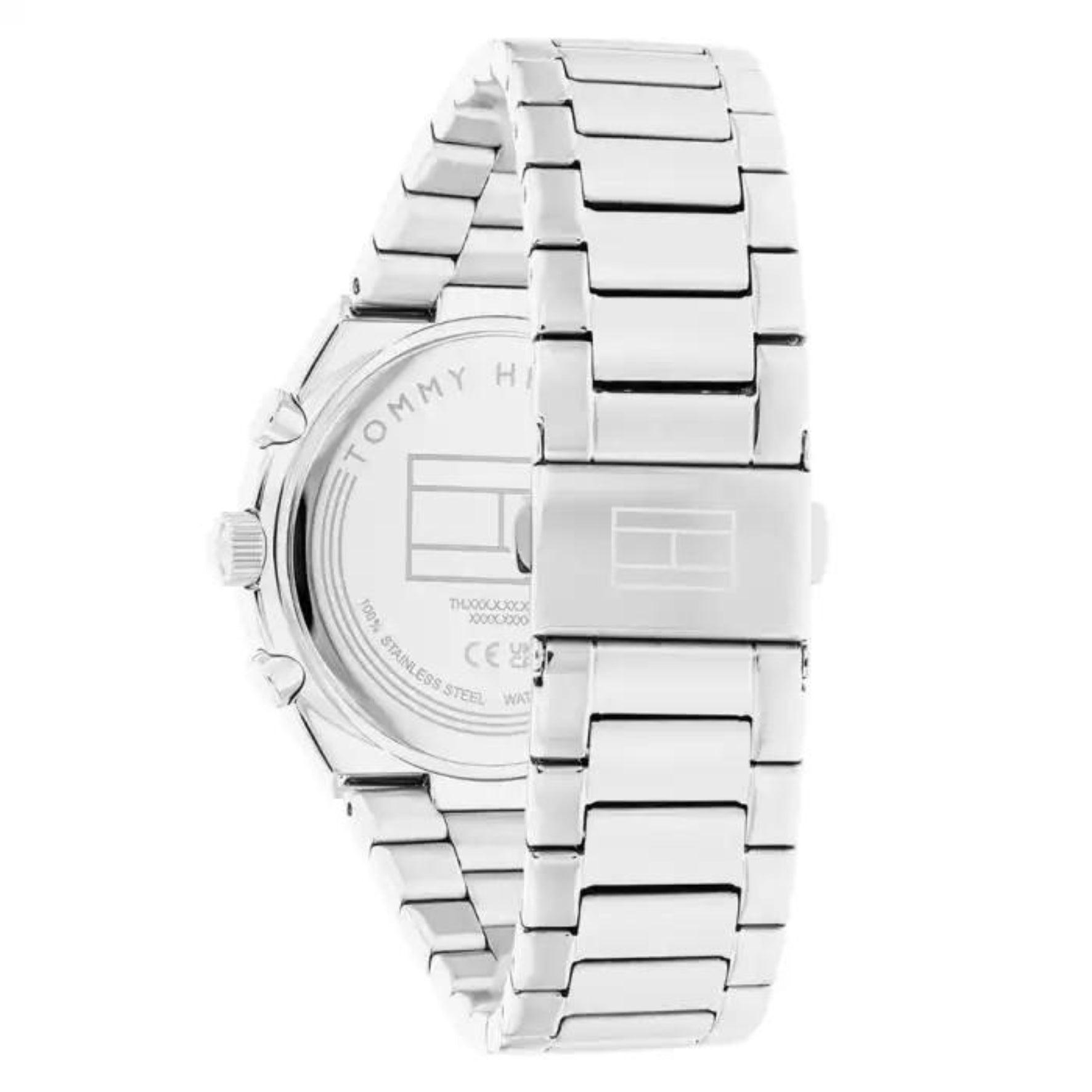 Γυναικείο ρολόι Tommy Hilfiger Carrie 1782573, με μπρασελέ σε ασημί χρώμα από ανοξείδωτο ατσάλι και λευκό καντράν με χρονογράφους και δείκτες σε χρυσό χρώμα.