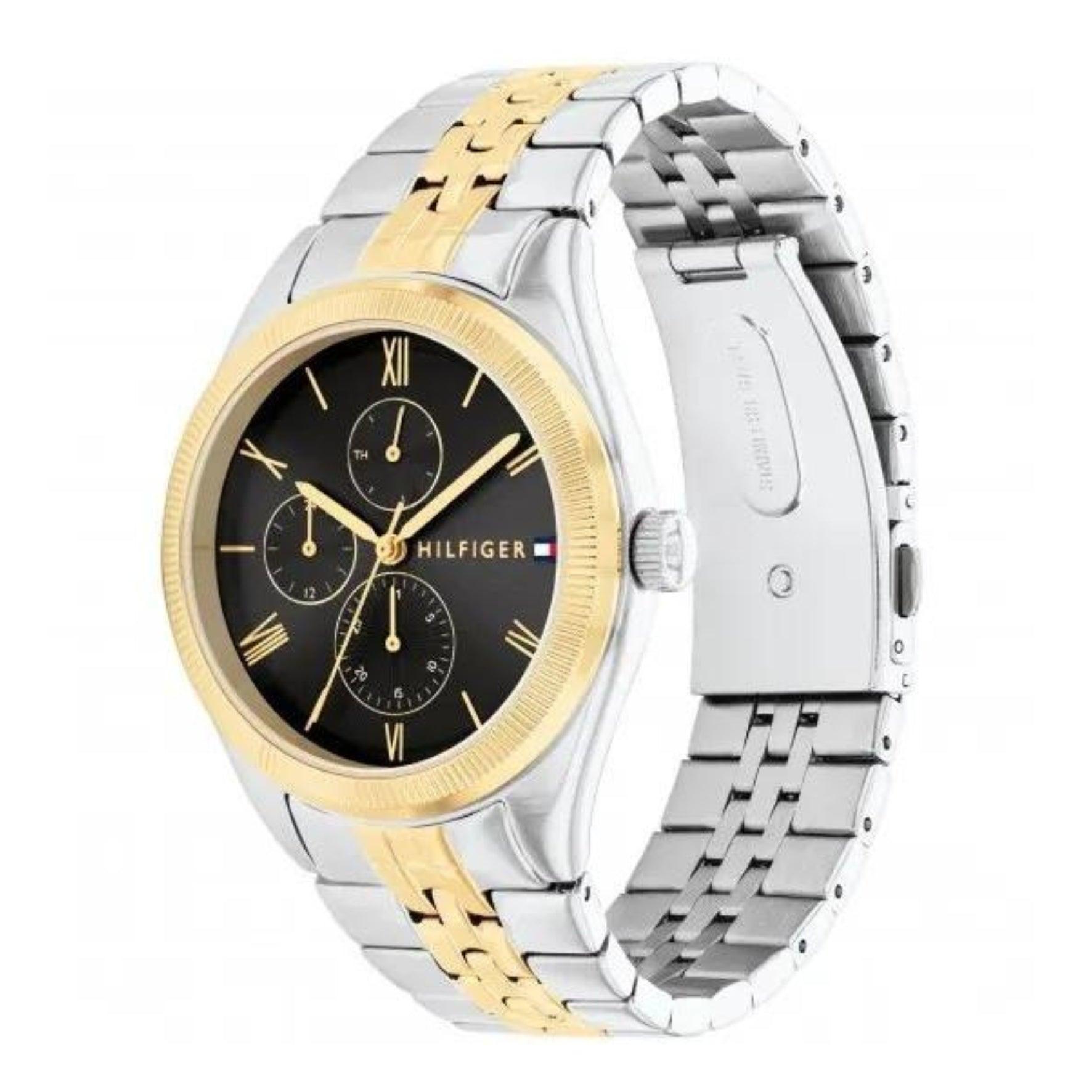 Γυναικείο ρολόι Tommy Hilfiger Monica 1782591, με δίχρωμο μπρασελέ σε ασημί-χρυσό χρώμα από ανοξείδωτο ατσάλι και μαύρο καντράν με χρονογράφους.