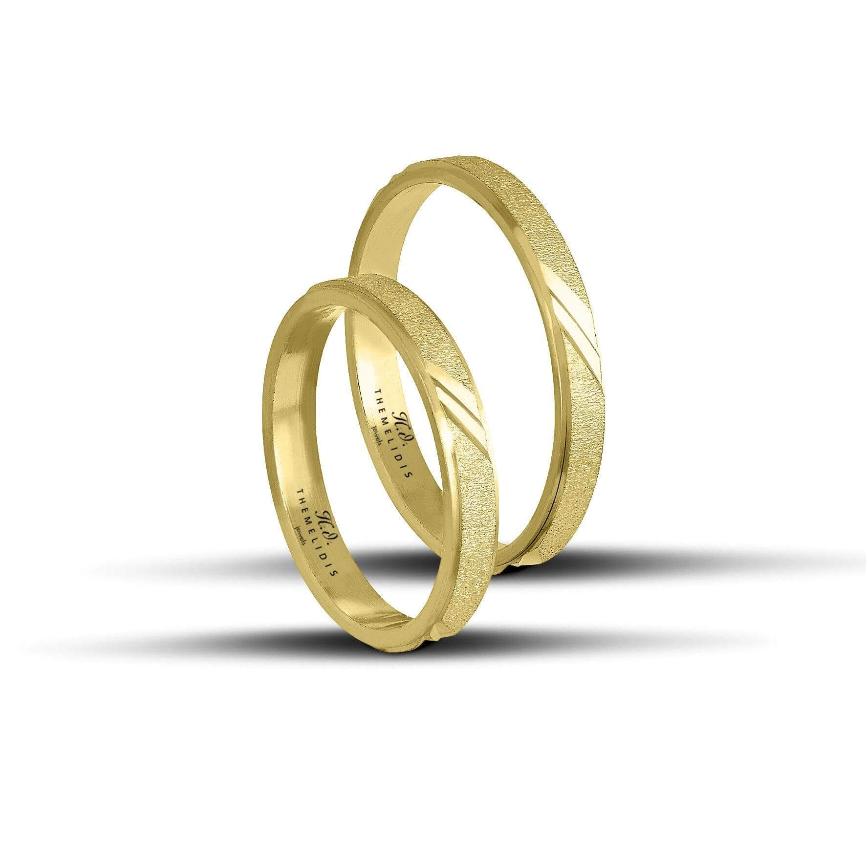 Μοντέρνες βέρες γάμου, χρυσές, με αμμοβολή και σχέδιο. Πλάτος 3mm.