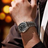 Ανδρικό ρολόι Citizen Tsuyosa 60 NK0020-55E φορεμένο στον καρπό με ασημί μπρασελέ από ανοξείδωτο ατσάλι.