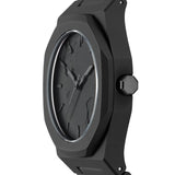 Κοντινό στο μαύρο 3D broken-stone καντράν του D1 Milano D1-PCBJ39 με μπλε αντιανακλαστική επίστρωση.