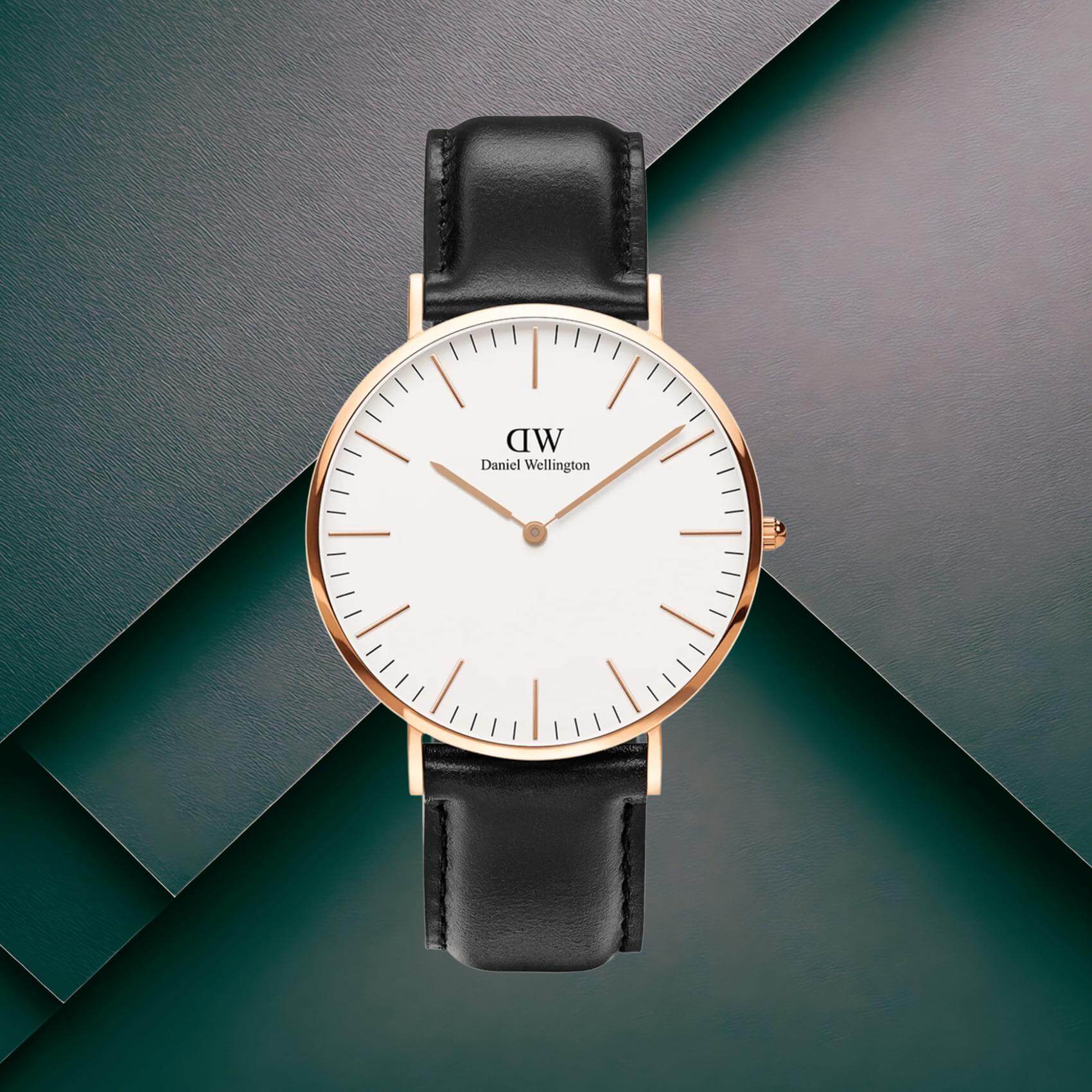 Ανδρικό ρολόι Daniel Wellington Classic Sheffield DW00100007 με μαύρο δερμάτινο λουράκι, λευκό στρογγυλό καντράν διαμέτρου 40mm και λεπτομέρειες σε ροζ χρυσό χρώμα.