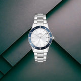 Ανδρικό ρολόι Daniel Wellington Iconic Paradigma DW00100818 με ασημί ατσάλινο μπρασελέ και ασημί καντράν διαμέτρου 40mm με μπλε λεπτομέρειες.