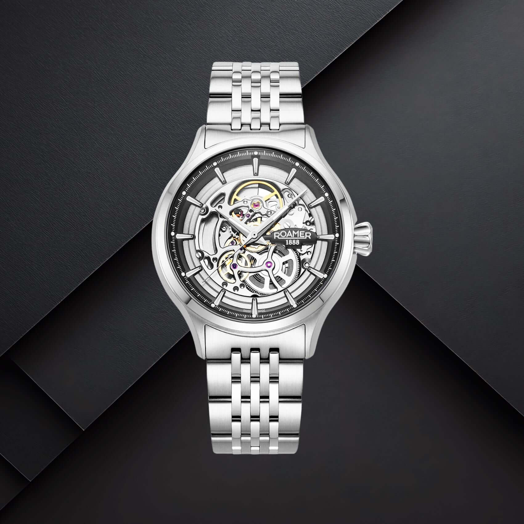 Ανδρικό ρολόι Roamer Competence Skeleton IV 101984-41-85-10 με ασημί μπρασελέ από ανοξείδωτο ατσάλι και ασημί skeleton καντράν με μαύρες λεπτομέρειες.
