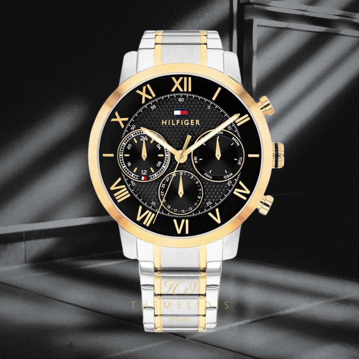 Φωτογραφία του ανδρικού ρολογιού Tommy Hilfiger TH Oxford 1710729 με δίχρωμο ασημί-χρυσό ατσάλινο μπρασελέ, μαύρο καντράν 42mm.