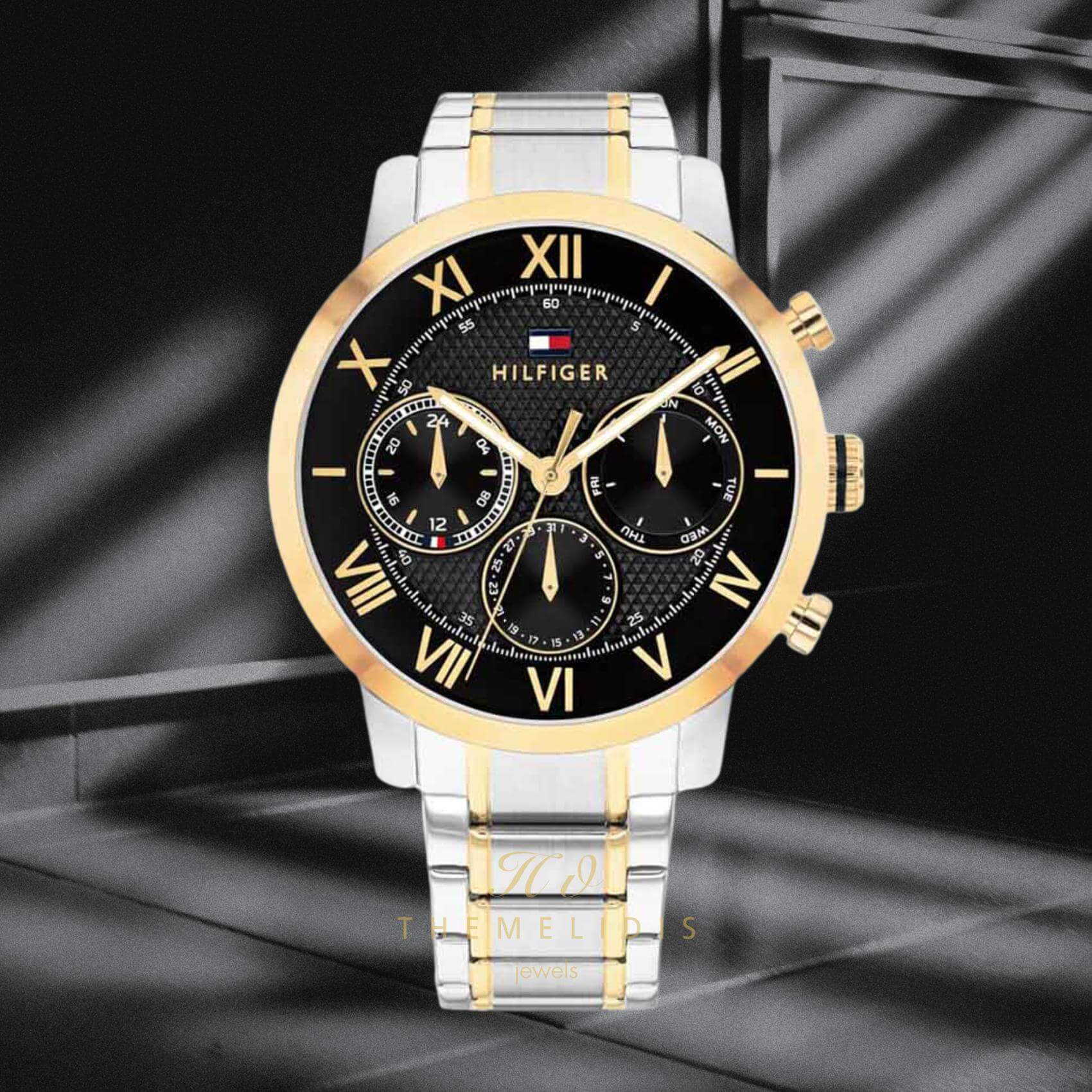 Φωτογραφία του ανδρικού ρολογιού Tommy Hilfiger TH Oxford 1710729 με δίχρωμο ασημί-χρυσό ατσάλινο μπρασελέ, μαύρο καντράν 42mm.