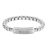 Ανδρικό βραχιόλι Boss 1580596M ατσάλινο με ασημί μπρασελέ και ασημί στοιχείο, κατασκευασμένο από χειρουργικό ατσάλι σε σχέδιο μπρασελέ.