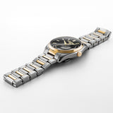 Αυτόματο ρολόι Roamer Elite 970983-47-85-20 με ασημί-χρυσό μπρασελέ και μαύρο καντράν 42mm.