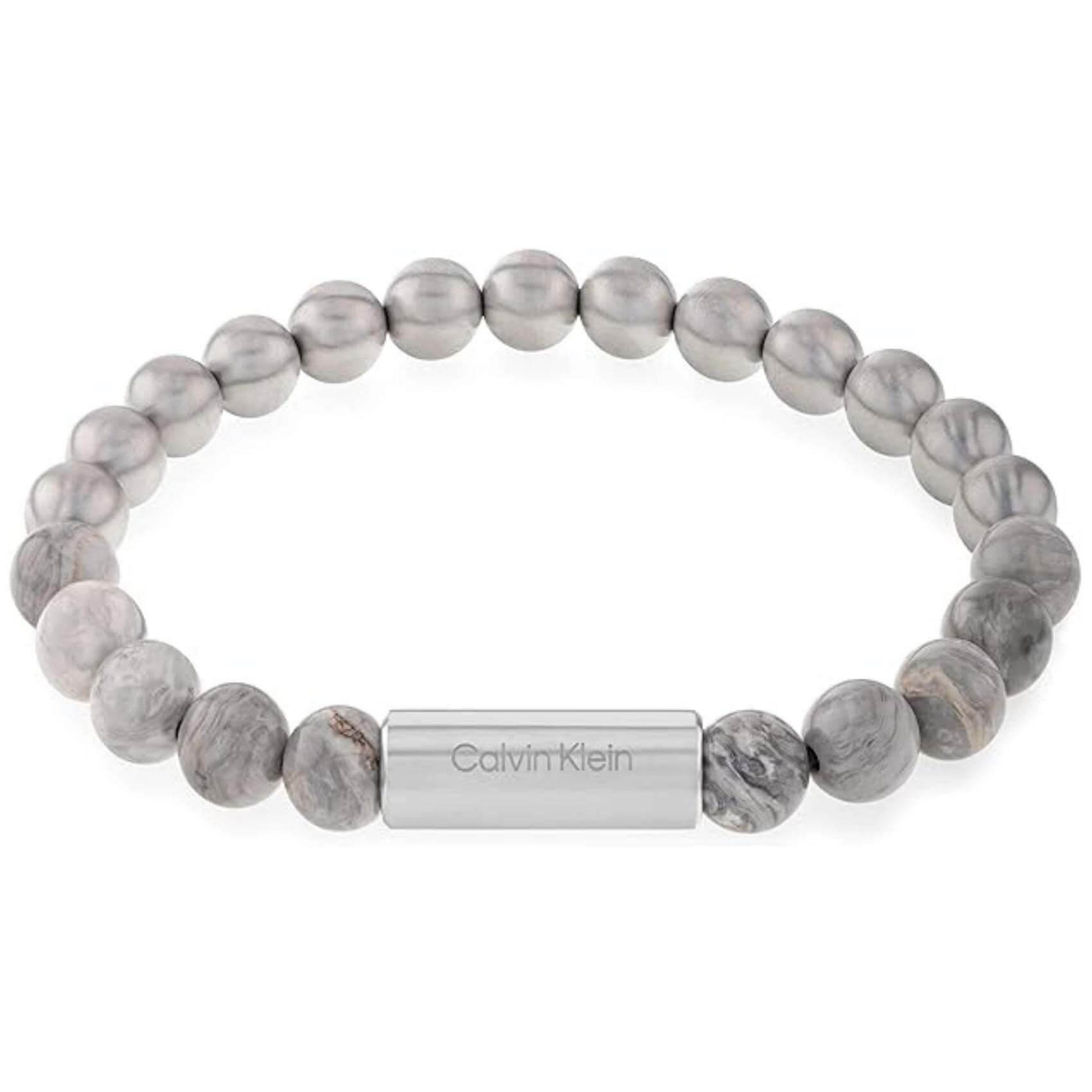Ανδρικό βραχιόλι Calvin Klein 35000427 με χάντρες ίασπις σε γκρι χρώμα διακοσμημένο με κυλινδρικό στοιχείο από ανοξείδωτο ατσάλι σε ασημί χρώμα.