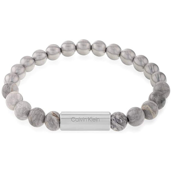 Ανδρικό βραχιόλι Calvin Klein 35000427 με χάντρες ίασπις σε γκρι χρώμα διακοσμημένο με κυλινδρικό στοιχείο από ανοξείδωτο ατσάλι σε ασημί χρώμα.