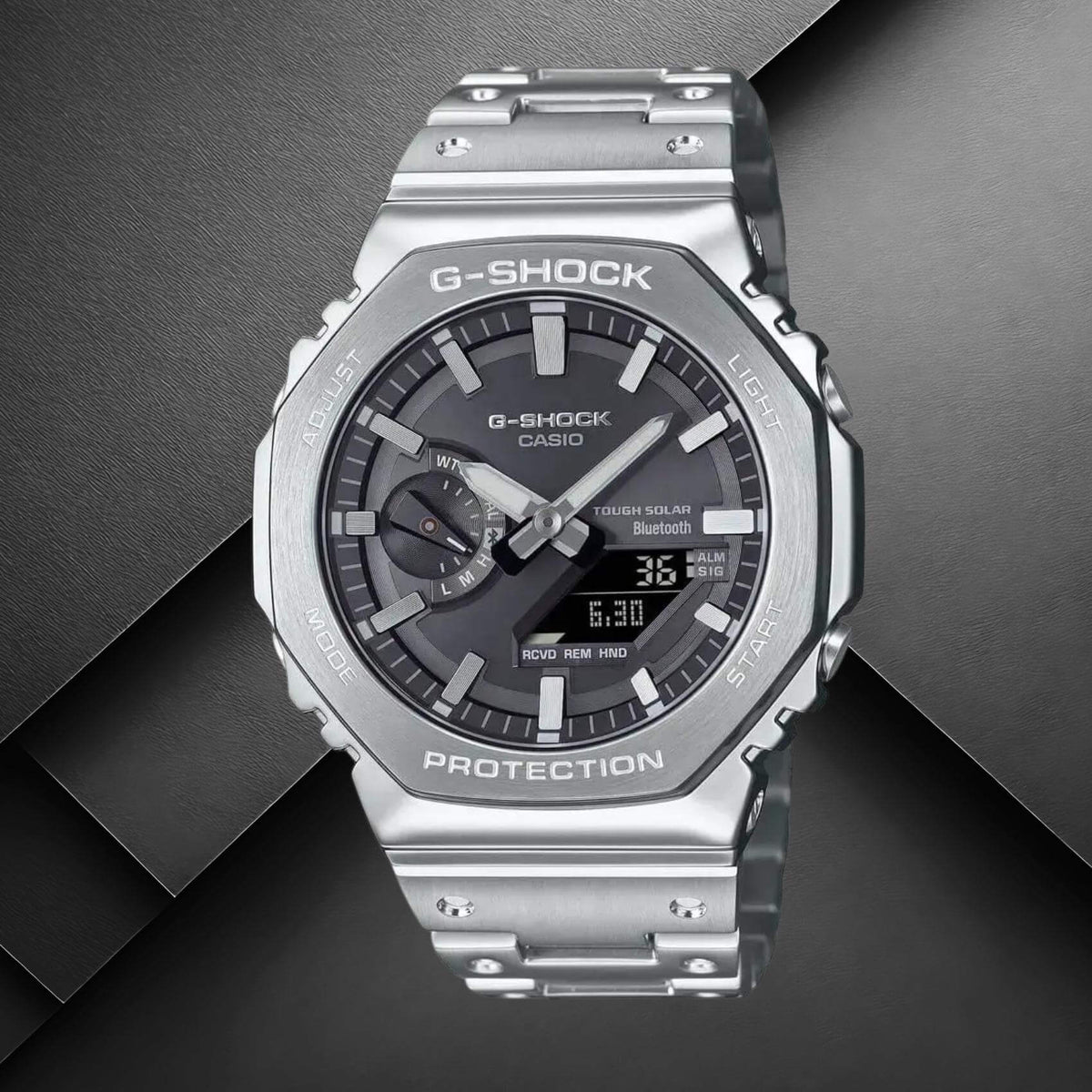 Ανδρικό ρολόι Casio G-SHOCK GM-B2100SD-1AER με ασημί ατσάλινο μπρασελέ και μαύρο καντράν.