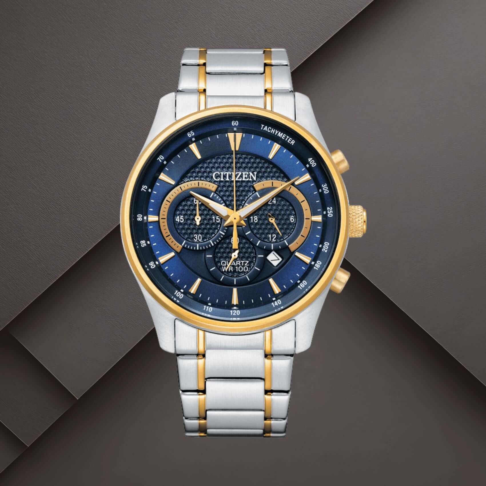 Citizen AN8194-51L ανδρικό ρολόι χρονογράφος με δίχρωμο ασημί-χρυσό μπρασελέ, μπλε καντράν 42mm και ένδειξη ημερομηνίας.