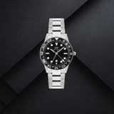 Daniel Wellington DW00100919 ανδρικό ρολόι με ασημί ατσάλινο μπρασελέ, μαύρο καντράν διαμέτρου 40mm, γκρι λεπτομέρειες και μαύρη κεραμική στεφάνη.
