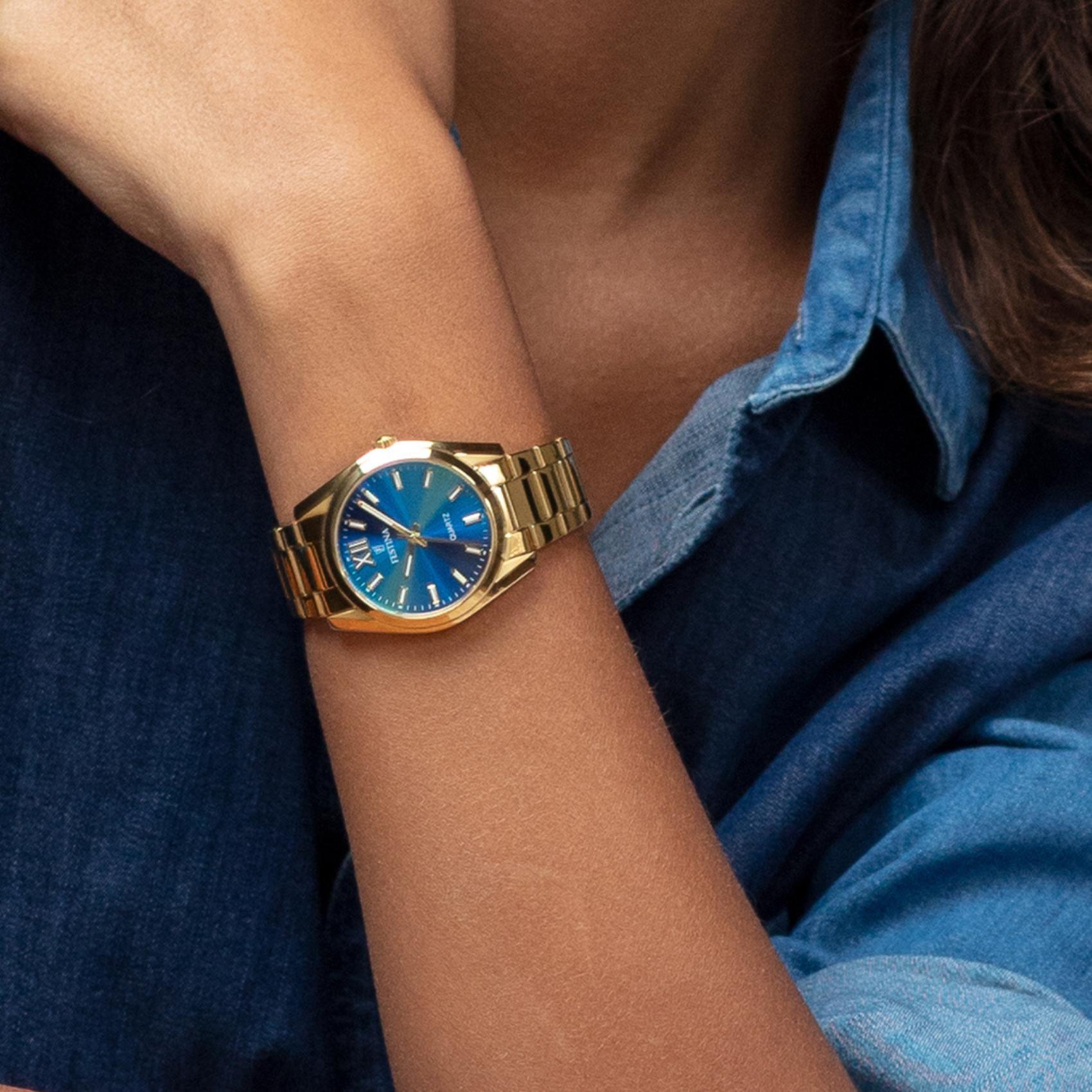 Γυναικείο ρολόι Festina Alegria F20640/8 με χρυσό ατσάλινο μπρασελέ, μπλε καντραν, μηχανισμό μπαταρίας στρογγυλό στεφάνι με διάμετρο 37mm, αδιάβροχο στις 5ΑΤΜ-50Μ.
