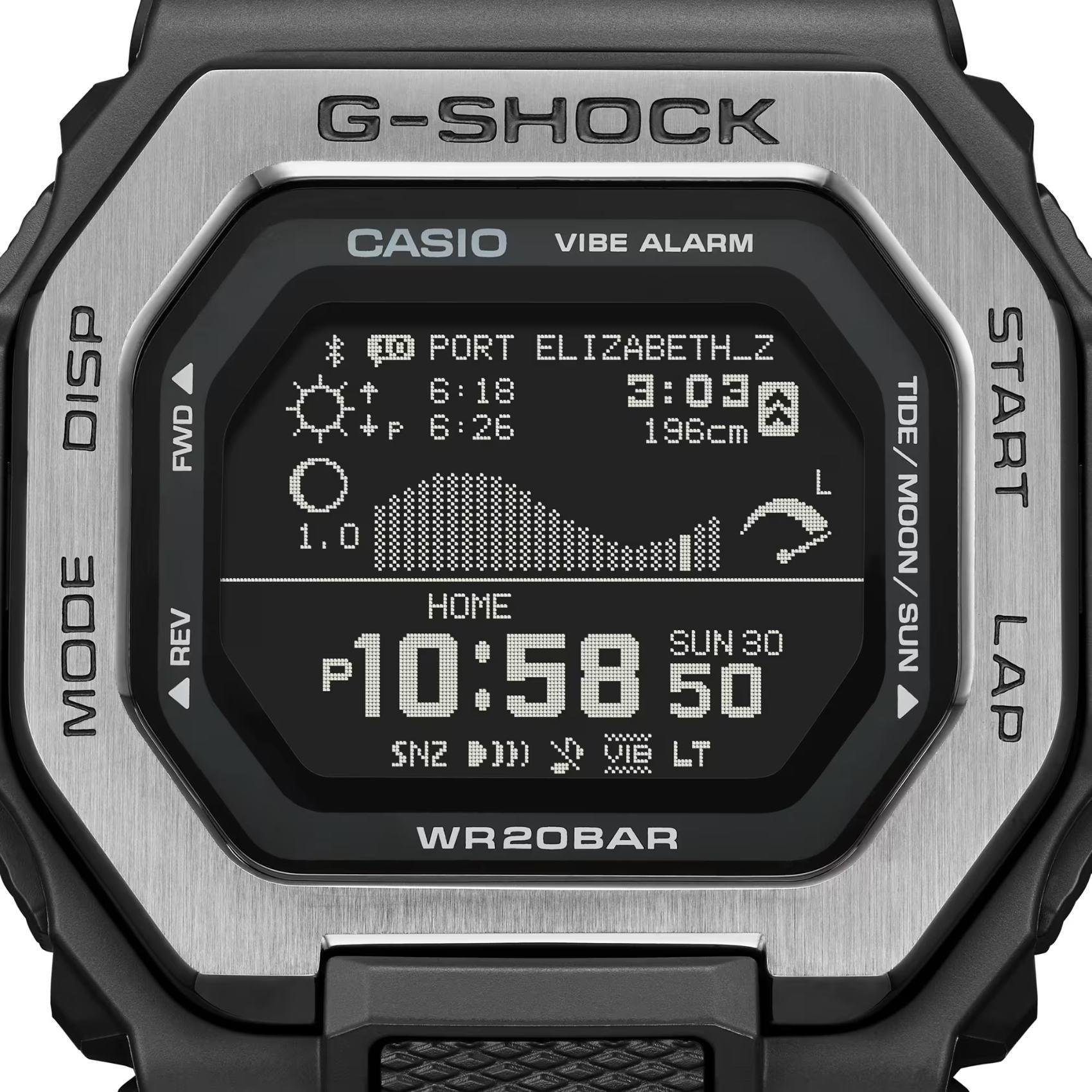 Ρολόι με λειτουργίες προπόνησης Casio G-Lide G-Shock GBX-100TT-8ER με γκρι καουτσούκ λουράκι και μαύρο καντράν διαμέτρου 46mm σε τετράγωνο σχημα.