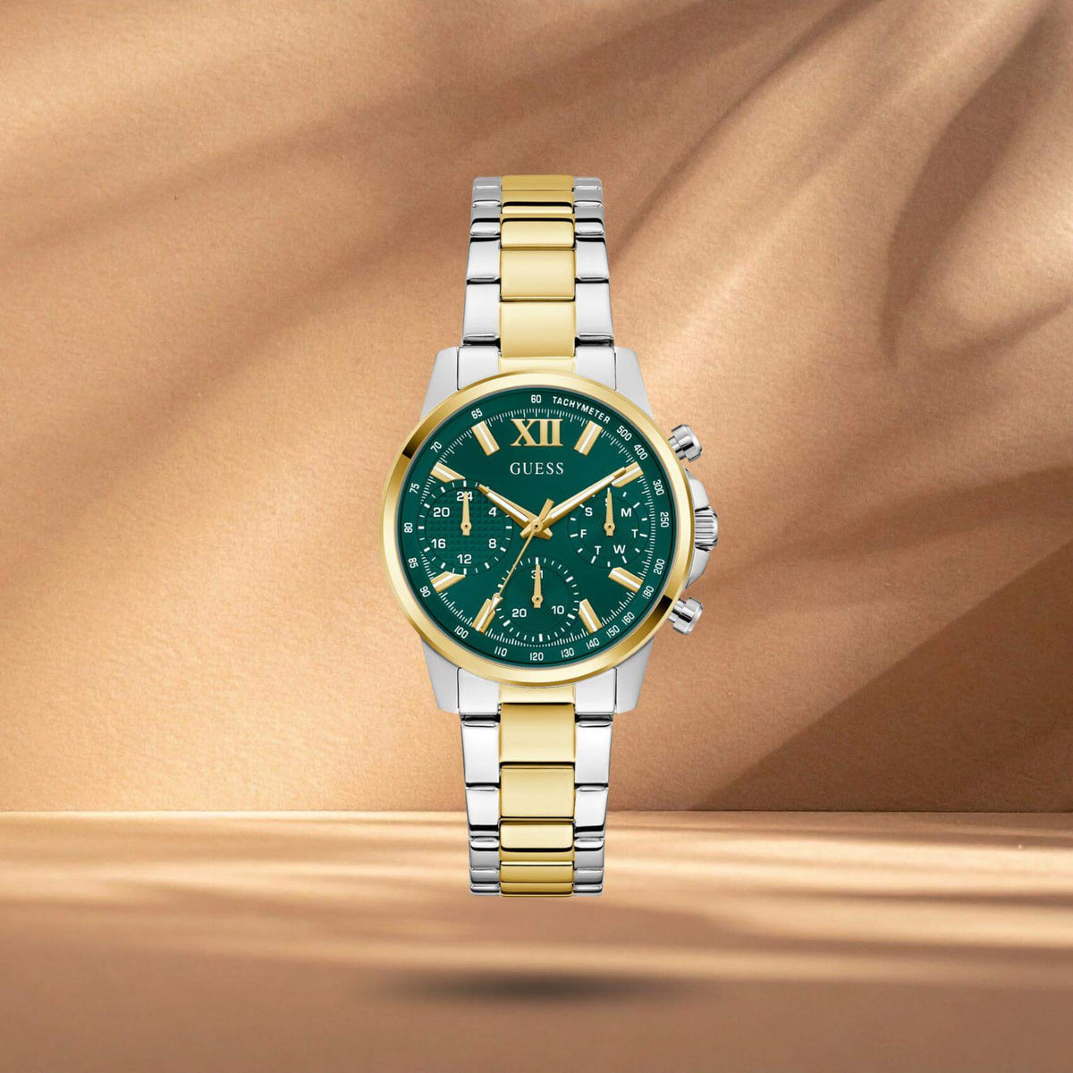 Guess GW0933L7 γυναικείο ρολόι με δίχρωμο ατσάλινο μπρασελέ σε ασημί και χρυσό χρώμα, πράσινο καντράν διαμέτρου 36mm και χρυσές λεπτομέρειες.