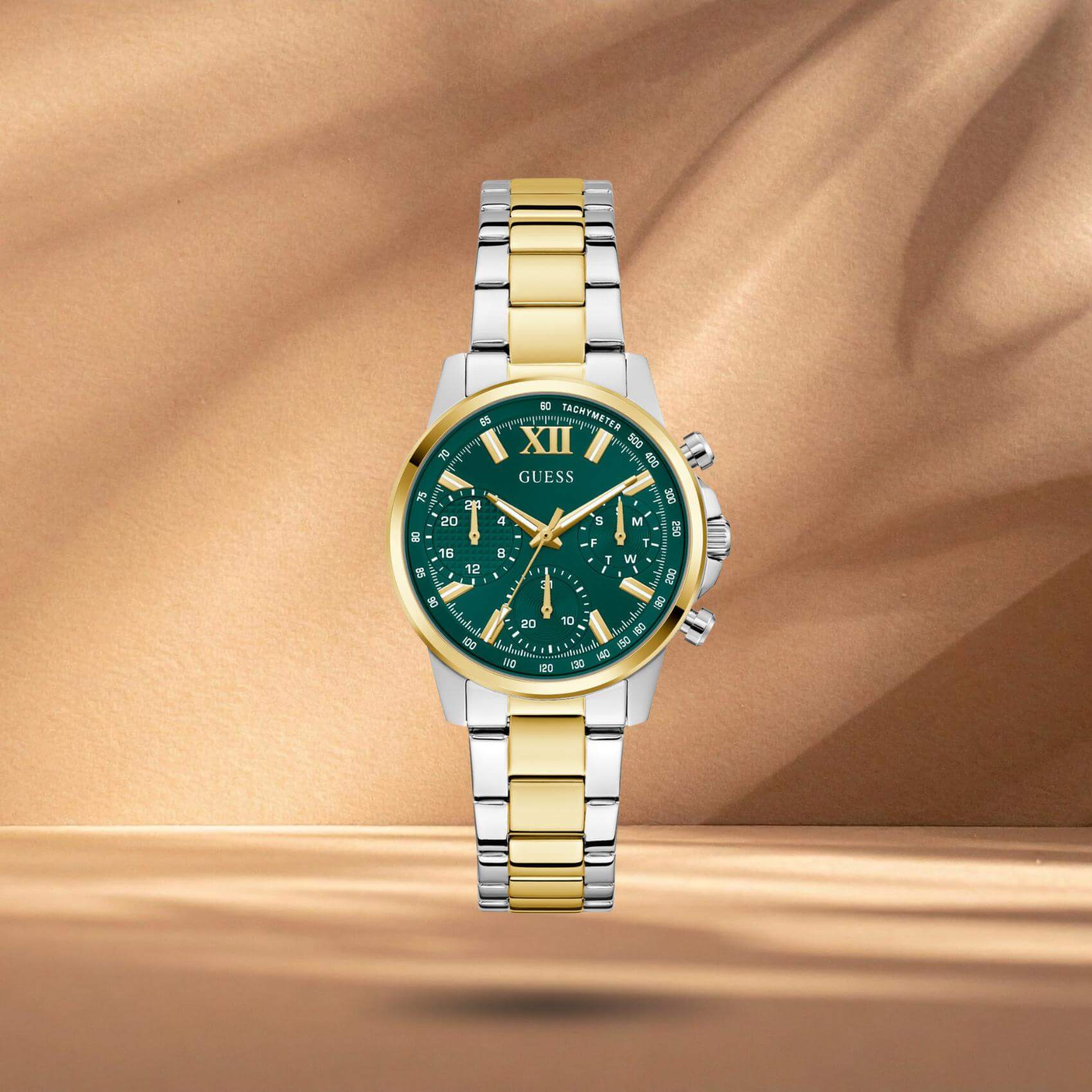 Guess GW0933L7 γυναικείο ρολόι με δίχρωμο ατσάλινο μπρασελέ σε ασημί και χρυσό χρώμα, πράσινο καντράν διαμέτρου 36mm και χρυσές λεπτομέρειες.