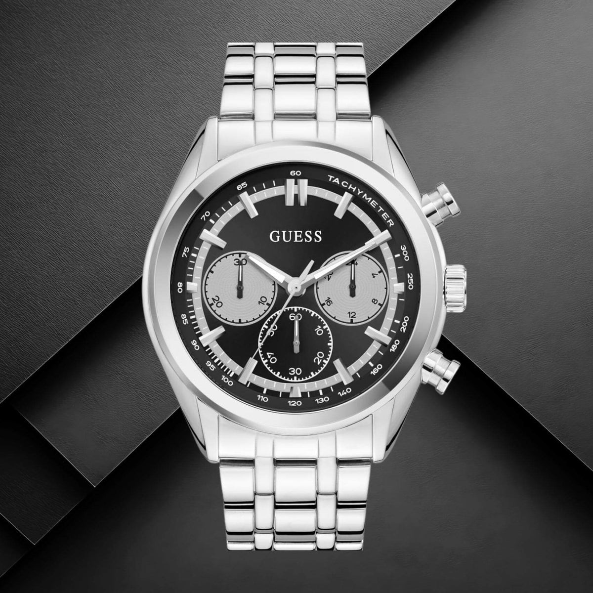 Guess GW0971G1 ανδρικό ρολόι με ασημί ατσάλινο μπρασελέ, μαύρο καντράν διαμέτρου 44mm και ασημί λεπτομέρειες.