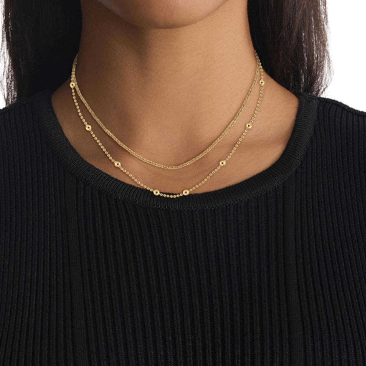 Διπλό γυναικείο κολιέ Calvin Klein Layered 35000950 χρυσό από ανοξείδωτο ατσάλι φορεμένο στον λαιμό