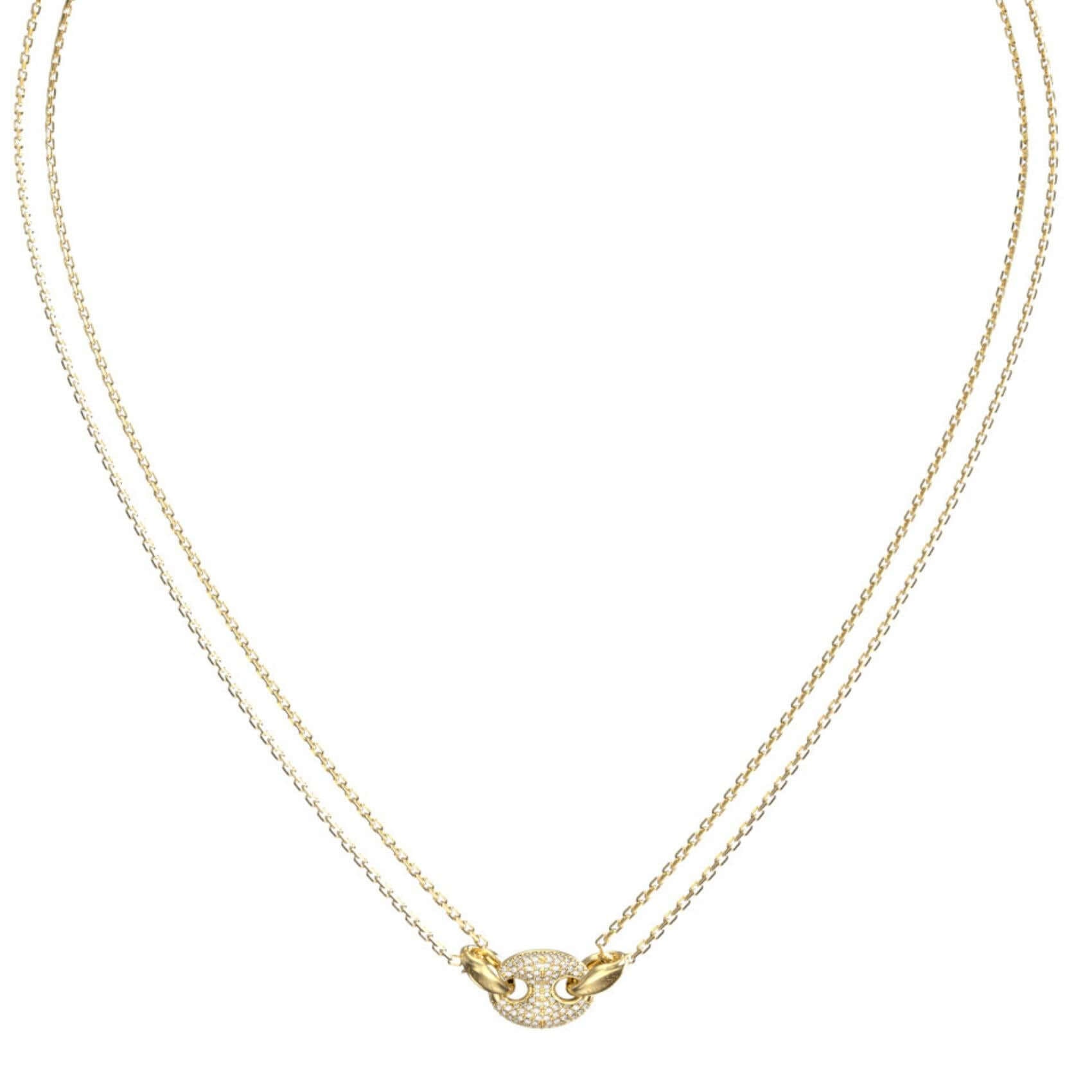 Λεπτομέρεια από το γυναικείο κολιέ Guess JUBN06220JWYGT/U από ανοξείδωτο ατσάλι σε χρυσό χρώμα με διπλή αλυσίδα και ζιργκόν.