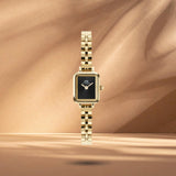 Γυναικείο ρολόι Daniel Wellington Quadro Mini Arch DW00100851 με χρυσό μπρασελέ από ανοξείδωτο ατσάλι και μαύρο καντράν μεγέθους 15x18mm.