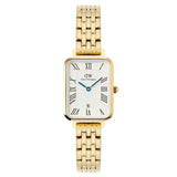Γυναικείο ρολόι Daniel Wellington Quadro Roman Numerals DW00100861 με χρυσό μπρασελέ από ανοξείδωτο ατσάλι και λευκό καντράν με μπλε δείκτες μεγέθους 20x26mm.