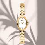 Γυναικείο ρολόι JCOU Aria JU19087-4 με χρυσό ατσάλινο μπρασελέ και λευκό καντράν.