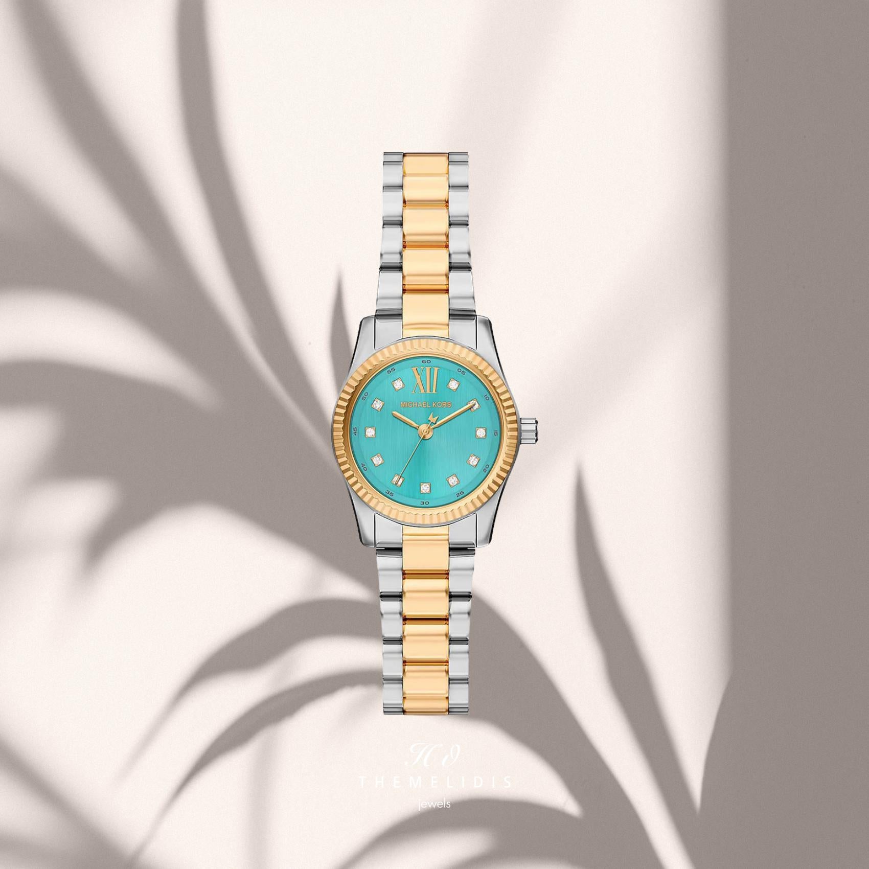 Γυναικείο ρολόι Michael Kors Lexington MK7579 με ασημί-χρυσό μπρασελέ, τιρκουάζ καντράν 26mm με δείκτες ζιργκόν