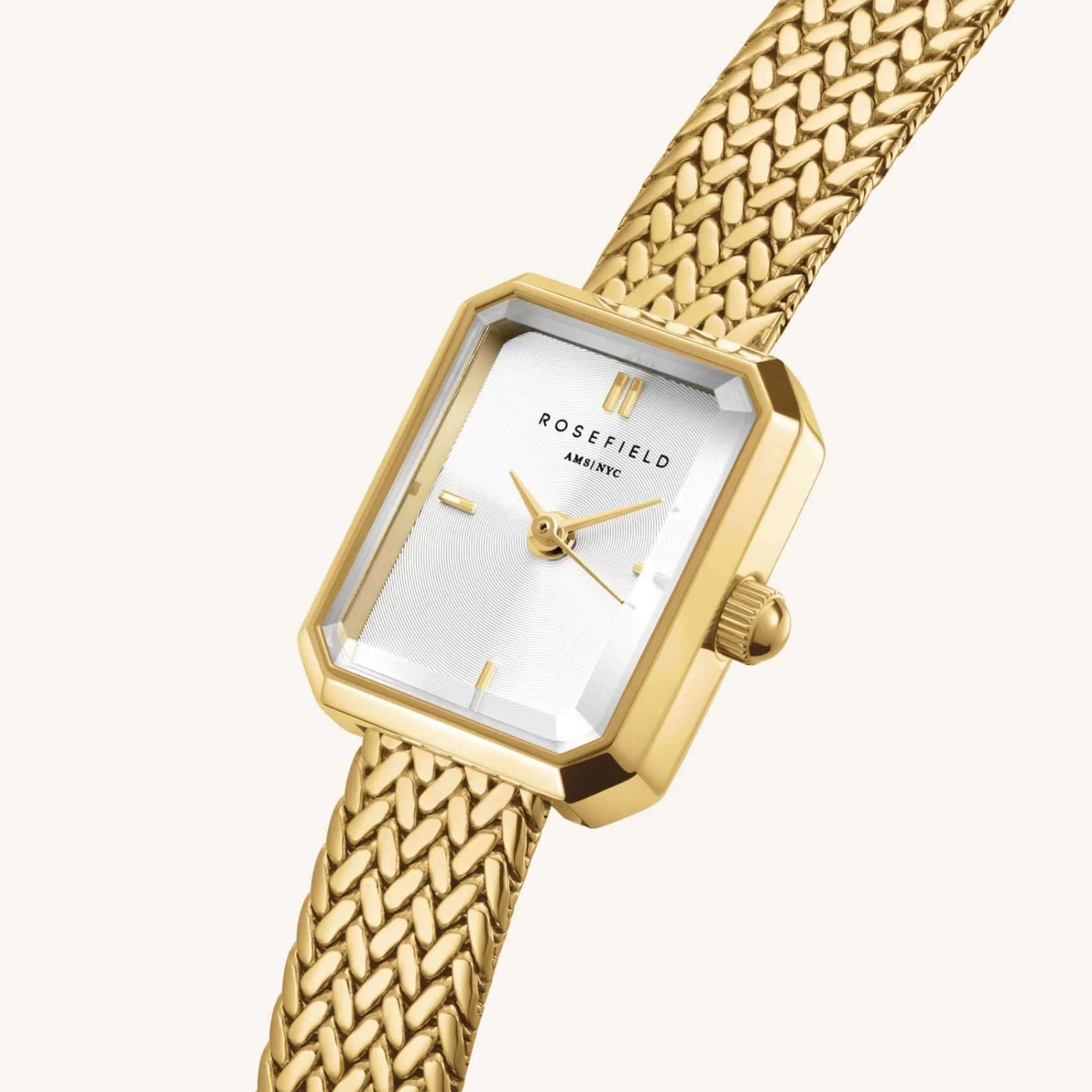 Γυναικείο ρολόι Rosefield Mini Octagon Gold MWGMG-M01 με χρυσό ατσάλινο μπρασελέ και άσπρο καντράν σε οκτάγωνο σχήμα μεγέθους 15mmX18.5mm, σε πλαϊνή λήψη.