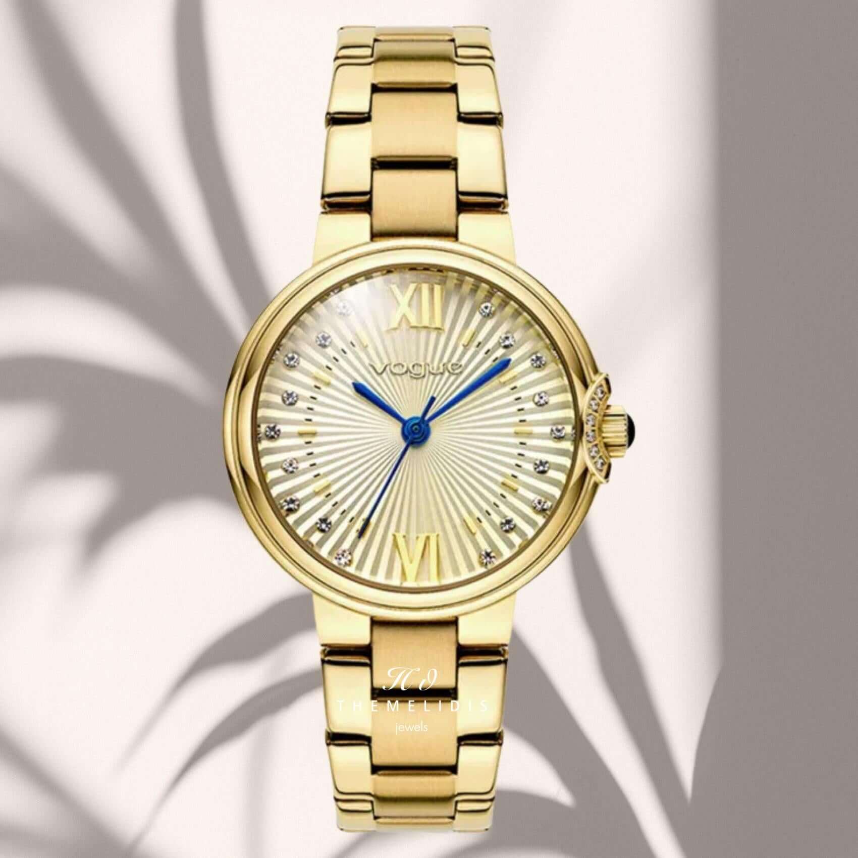 Φωτογραφία του γυναικείου ρολογιού Vogue Carmen Mini 2020616042 με χρυσό μπρασελέ και σαμπανί καντράν με ζιργκόν, αναδεικνύοντας τη λαμπερή και κομψή αισθητική του