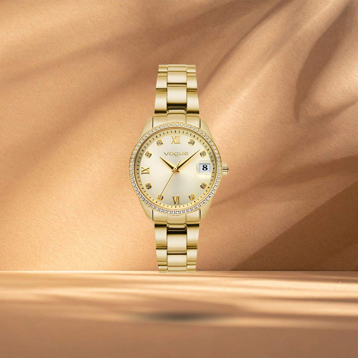 Γυναικείο ρολόι Vogue Reina Mini 2020614344 με σαμπανί καντράν 27mm και χρυσό ατσάλινο μπρασελέ με ένδειξη ημερομηνίας.