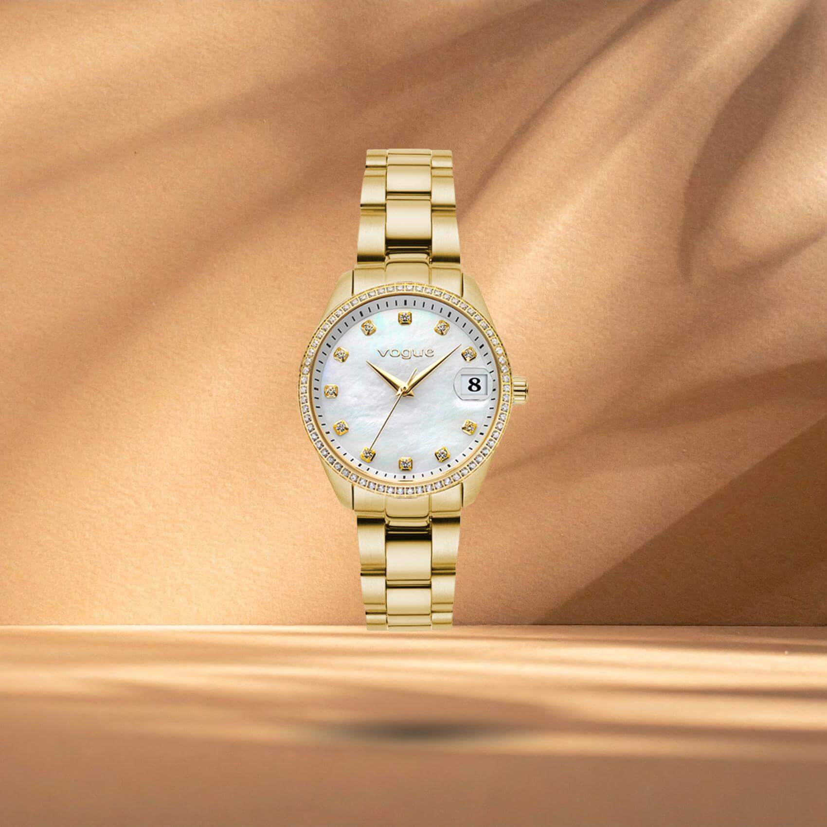 Γυναικείο ρολόι Vogue Reina Mini 2020614346 με λευκό φίλντισι καντράν 27mm και χρυσό ατσάλινο μπρασελέ με ένδειξη ημερομηνίας.